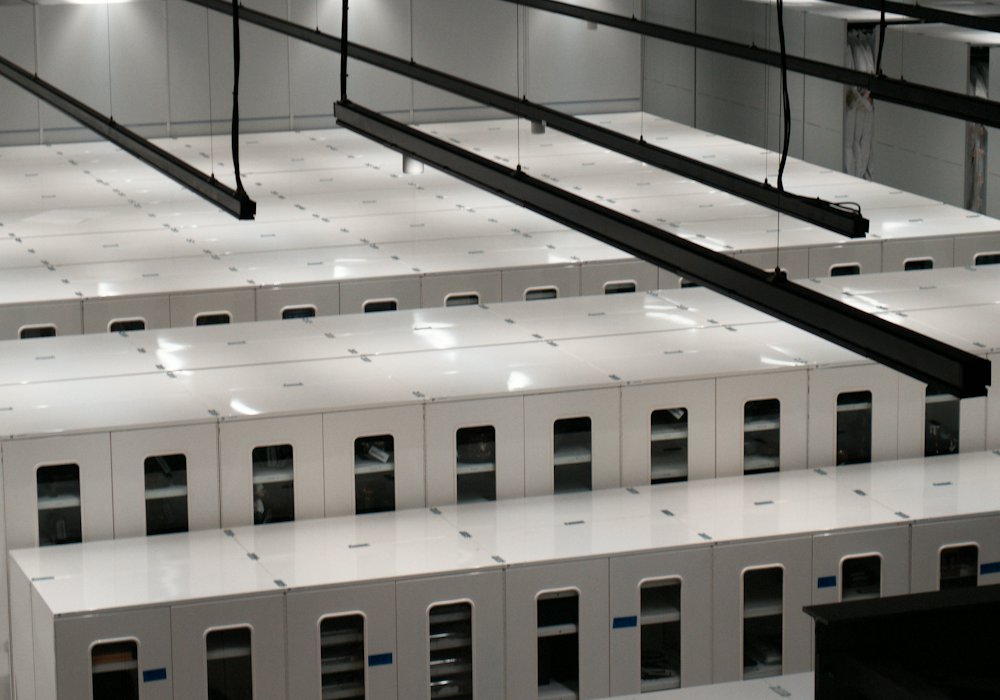 Rows of white server cabinets in a data centre